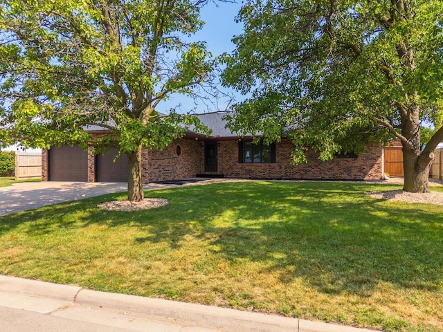 1413 Bethany Ln, Pontiac, IL 61764 - view of front of property with concrete driveway, brick siding, and a garage