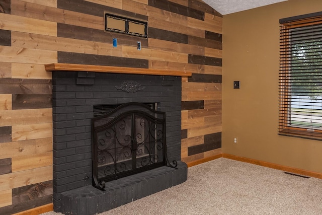 1413 Bethany Ln, Pontiac, IL 61764 - detailed view of wooden walls, a brick fireplace, and carpet
