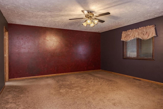 1413 Bethany Ln, Pontiac, IL 61764 - empty room with a ceiling fan, carpet flooring, and a textured ceiling