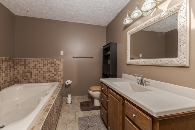 1413 Bethany Ln, Pontiac, IL 61764 - bathroom with a jetted tub, vanity, a textured ceiling, and tile patterned flooring