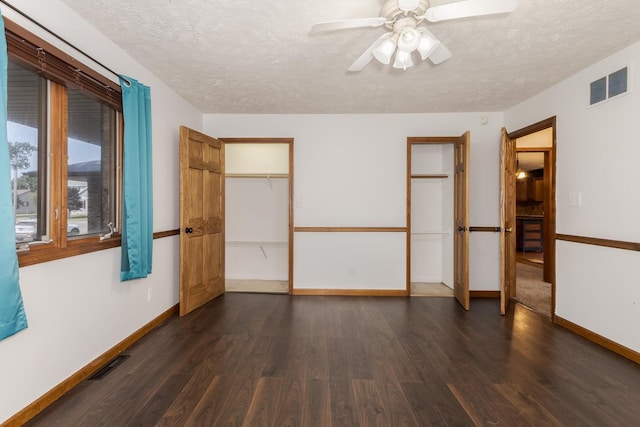 1413 Bethany Ln, Pontiac, IL 61764 - unfurnished room featuring dark wood-type flooring, a textured ceiling, and a ceiling fan