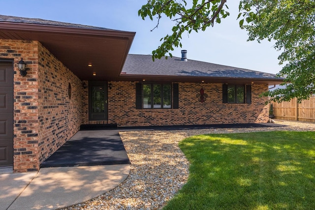 1413 Bethany Ln, Pontiac, IL 61764 - property entrance featuring brick siding and a shingled roof