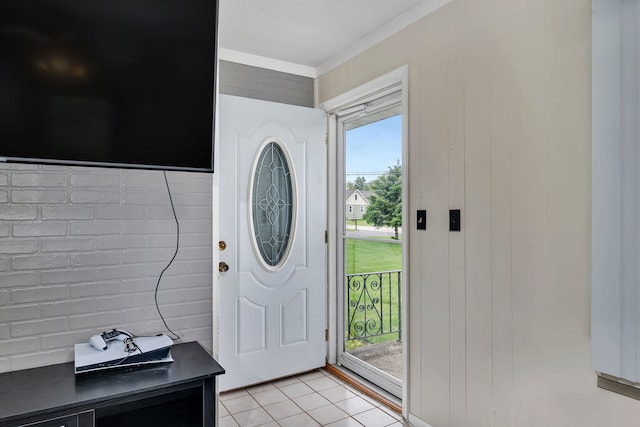 341 N Center St, Braidwood, IL 60408 - foyer featuring light tile patterned flooring, crown molding, and wooden walls