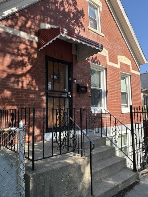 3417 S Morgan St, Chicago, IL 60608 - view of exterior entry featuring brick siding