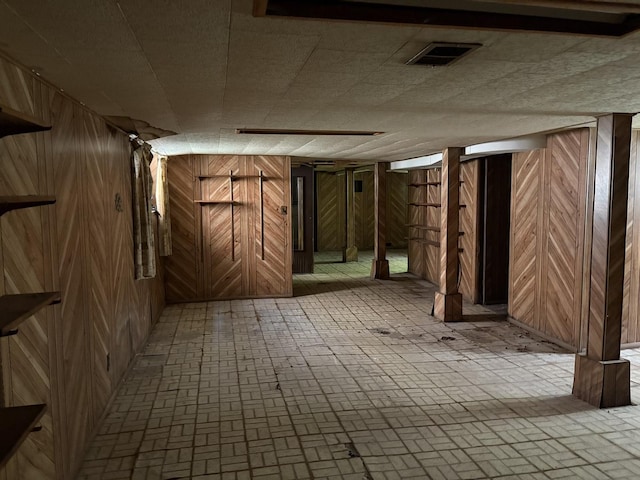 5535 S Fairfield Ave, Chicago, IL 60629 - finished basement featuring wooden walls and brick patterned flooring