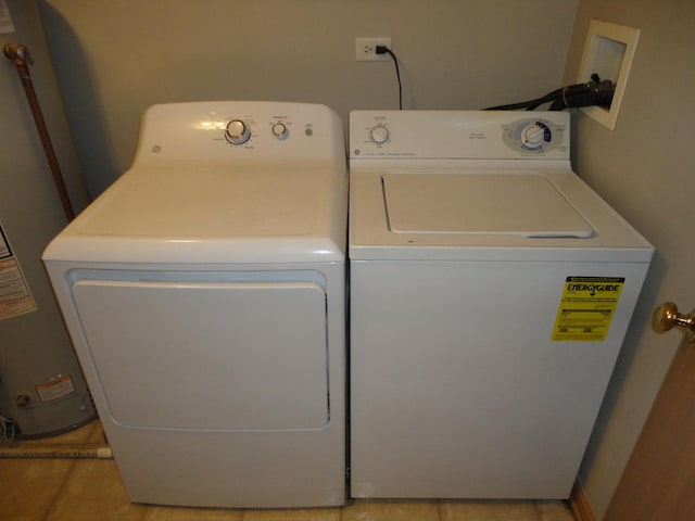 371 Mcgrath Dr, Oswego, IL 60543 - laundry room with independent washer and dryer, water heater, and light tile patterned flooring