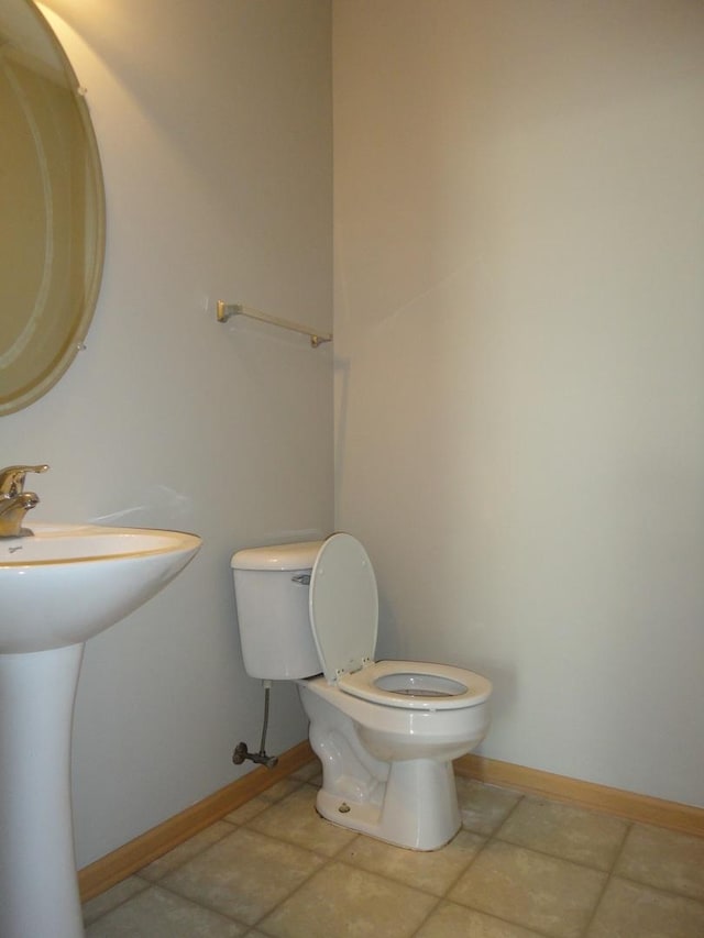 371 Mcgrath Dr, Oswego, IL 60543 - half bath featuring toilet and tile patterned floors