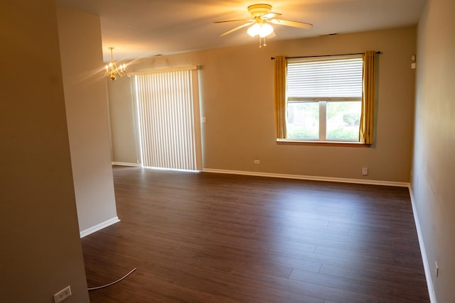 371 Mcgrath Dr, Oswego, IL 60543 - spare room with a ceiling fan, a chandelier, and dark wood-style floors