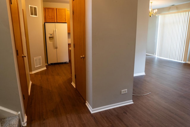371 Mcgrath Dr, Oswego, IL 60543 - hall with dark wood-style flooring and a chandelier
