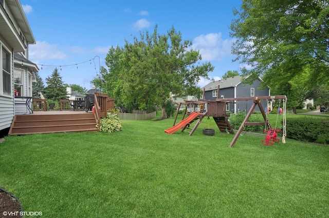 1167 Book Rd, Naperville, IL 60540 - view of grassy yard with a playground and a deck
