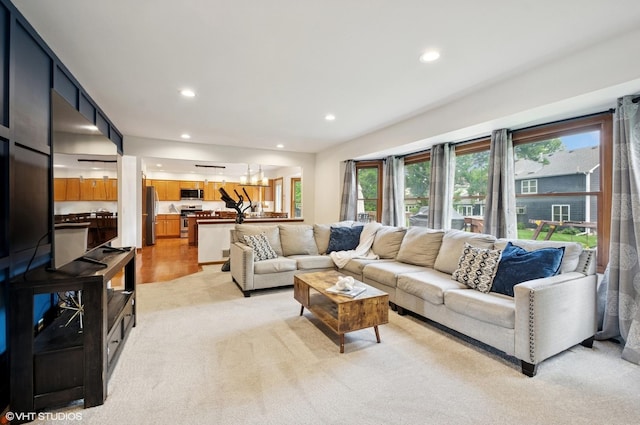 1167 Book Rd, Naperville, IL 60540 - living area featuring light carpet, recessed lighting, and a chandelier
