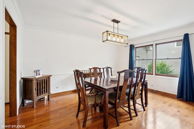 1167 Book Rd, Naperville, IL 60540 - dining room featuring light wood-style floors and ornamental molding