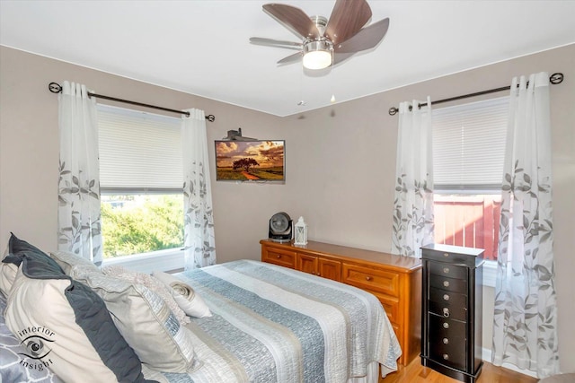 7117 W 82nd Pl, Burbank, IL 60459 - bedroom featuring ceiling fan and light wood-style floors