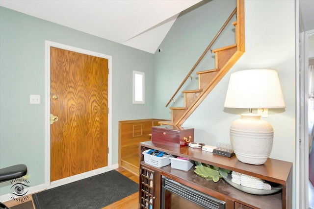 7117 W 82nd Pl, Burbank, IL 60459 - foyer entrance featuring stairway, lofted ceiling, and wood finished floors