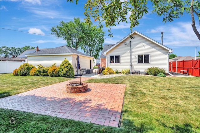 7117 W 82nd Pl, Burbank, IL 60459 - back of house with an outdoor fire pit and a patio area