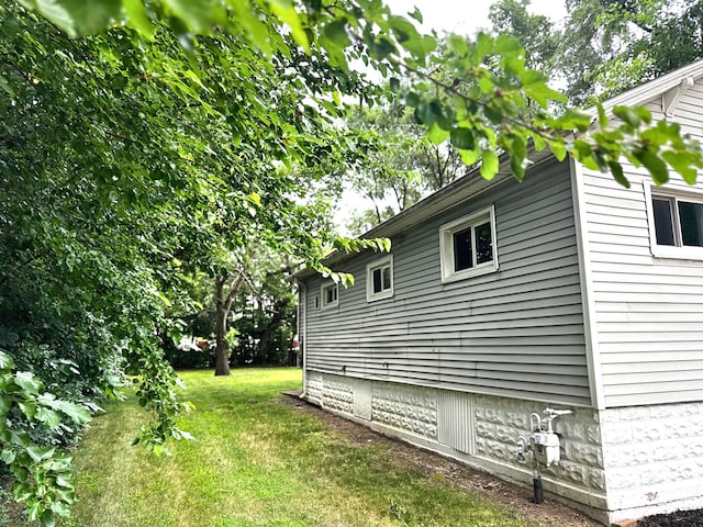 10007 S Hoxie Ave, Chicago, IL 60617 - view of property exterior featuring a yard