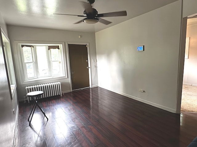10007 S Hoxie Ave, Chicago, IL 60617 - empty room featuring radiator, ceiling fan, and wood-type flooring