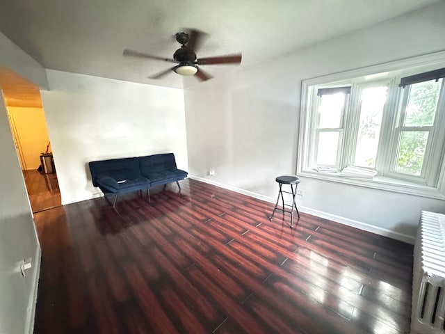 10007 S Hoxie Ave, Chicago, IL 60617 - sitting room featuring wood finished floors, a ceiling fan, and radiator
