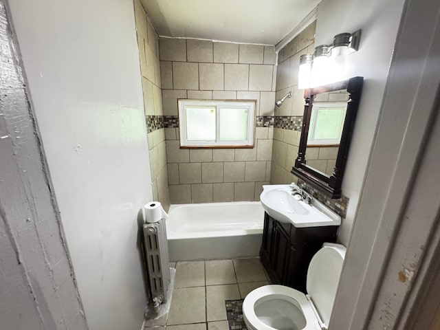 10007 S Hoxie Ave, Chicago, IL 60617 - full bathroom with radiator, plenty of natural light, tile patterned flooring, and vanity