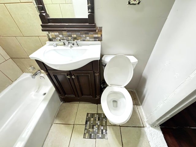 10007 S Hoxie Ave, Chicago, IL 60617 - full bathroom with a bathtub, vanity, tile patterned flooring, and tasteful backsplash