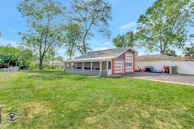 17436 71st Ave, Tinley Park, IL 60477 - fenced yard with a sunroom and a detached garage