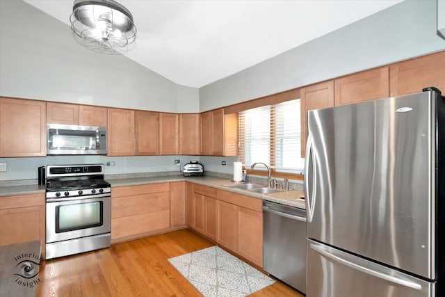 17436 71st Ave, Tinley Park, IL 60477 - kitchen featuring stainless steel appliances, light countertops, light wood-style flooring, high vaulted ceiling, and light brown cabinets