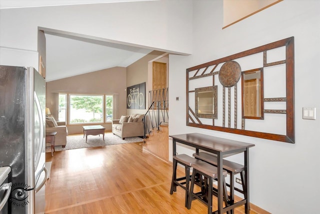 17436 71st Ave, Tinley Park, IL 60477 - foyer entrance featuring light wood-type flooring, stairs, and high vaulted ceiling