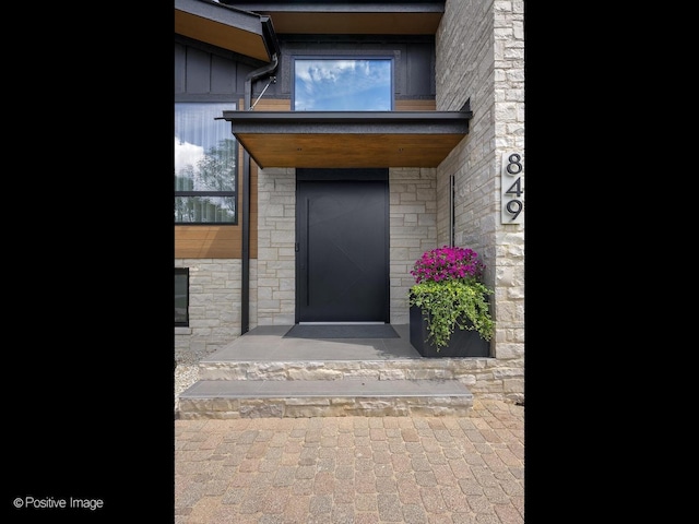849 Cramer Ct, Willowbrook, IL 60527 - entrance to property featuring stone siding, board and batten siding, and elevator
