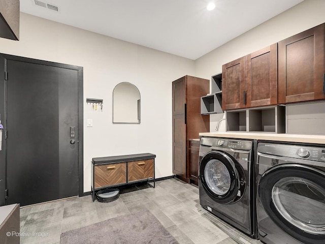 849 Cramer Ct, Willowbrook, IL 60527 - laundry area featuring washer and clothes dryer, cabinet space, and light wood finished floors