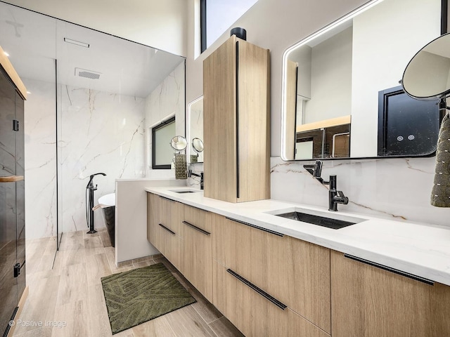 849 Cramer Ct, Willowbrook, IL 60527 - full bathroom featuring double vanity, a soaking tub, wood finished floors, and a marble finish shower