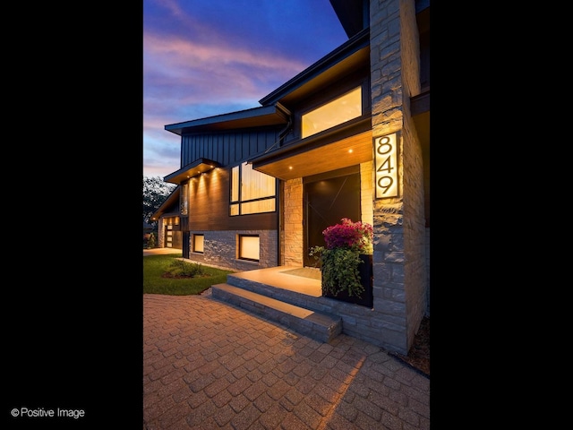 849 Cramer Ct, Willowbrook, IL 60527 - property entrance featuring stone siding and board and batten siding