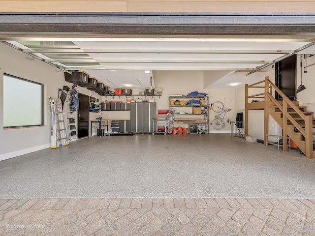 849 Cramer Ct, Willowbrook, IL 60527 - garage with baseboards and a workshop area
