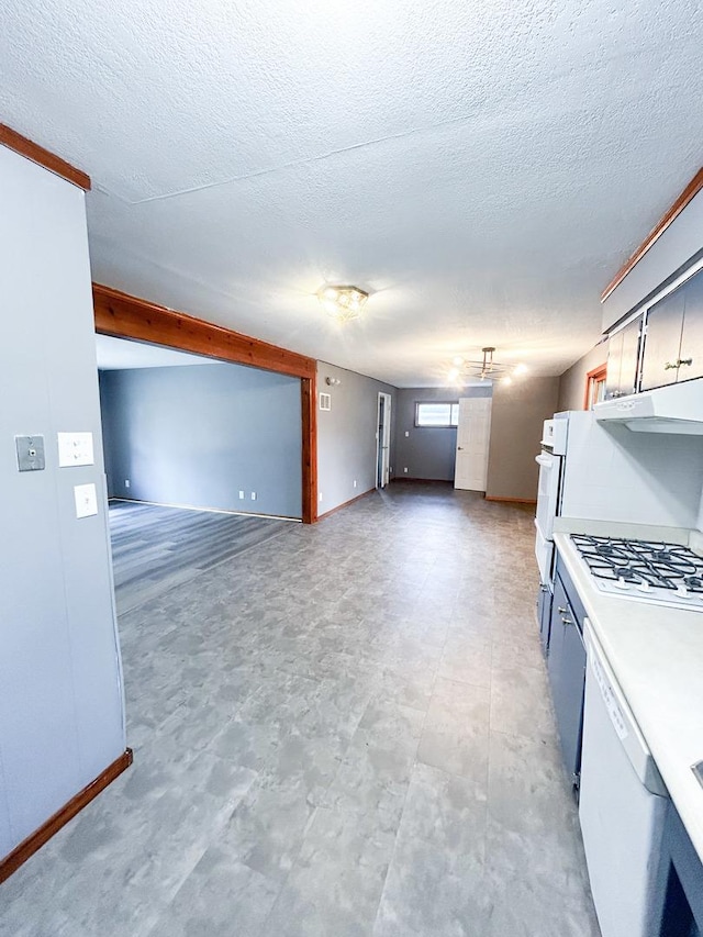 425 W Donald St, Kankakee, IL 60901 - kitchen featuring under cabinet range hood, white appliances, a textured ceiling, open floor plan, and light countertops