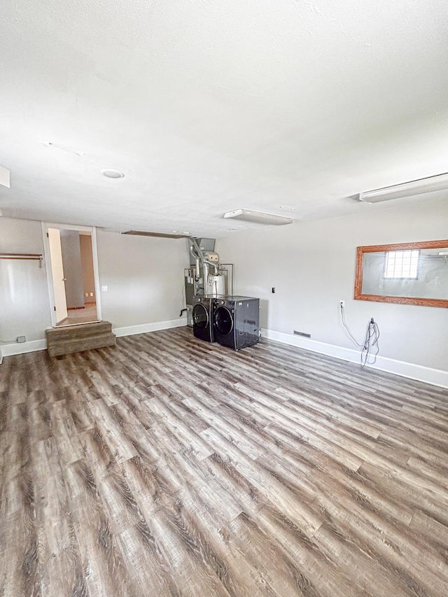 425 W Donald St, Kankakee, IL 60901 - unfurnished living room with wood finished floors and washer and clothes dryer
