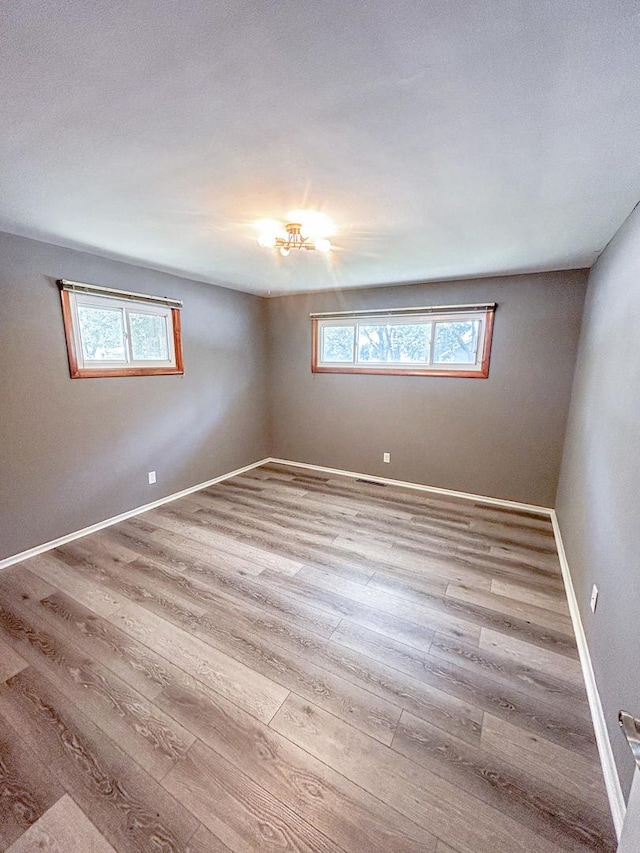 425 W Donald St, Kankakee, IL 60901 - spare room featuring healthy amount of natural light and wood finished floors