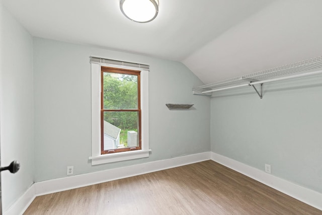 637/639 E Wilson St, Batavia, IL 60510 - spacious closet featuring wood finished floors and vaulted ceiling