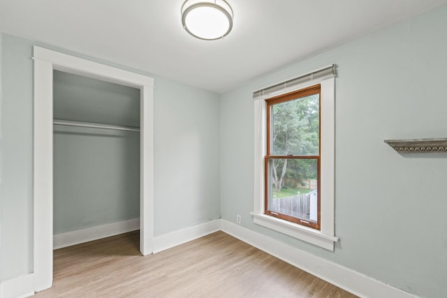 637/639 E Wilson St, Batavia, IL 60510 - unfurnished bedroom with wood finished floors and a closet