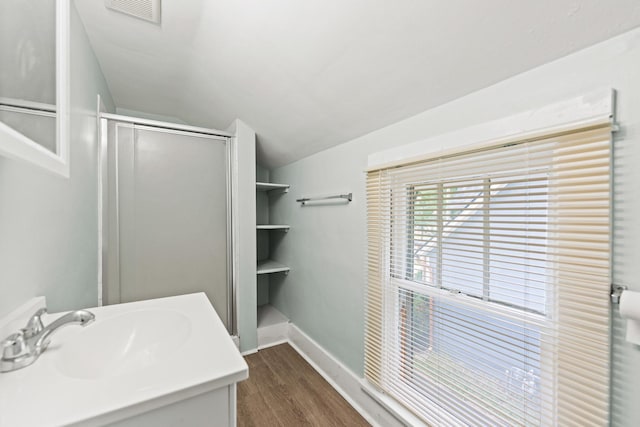637/639 E Wilson St, Batavia, IL 60510 - full bathroom with a shower stall, lofted ceiling, wood finished floors, and vanity