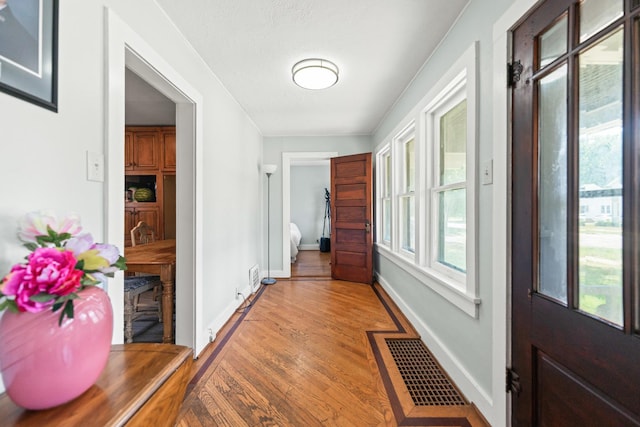 637/639 E Wilson St, Batavia, IL 60510 - hallway featuring baseboards and light wood-type flooring