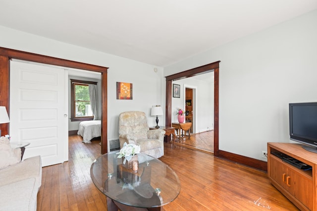 637/639 E Wilson St, Batavia, IL 60510 - living room featuring baseboards and light wood finished floors