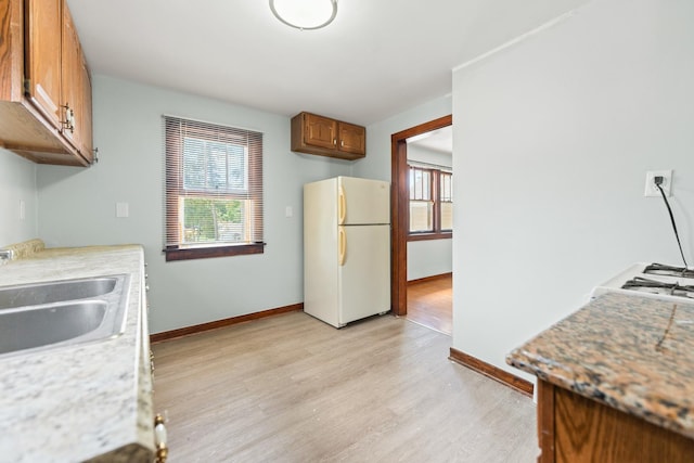 637/639 E Wilson St, Batavia, IL 60510 - kitchen featuring freestanding refrigerator, healthy amount of natural light, light wood-type flooring, and light countertops