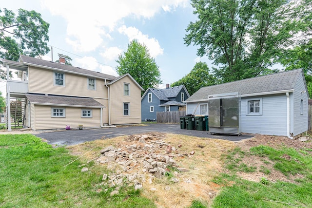637/639 E Wilson St, Batavia, IL 60510 - back of property featuring driveway and an outbuilding