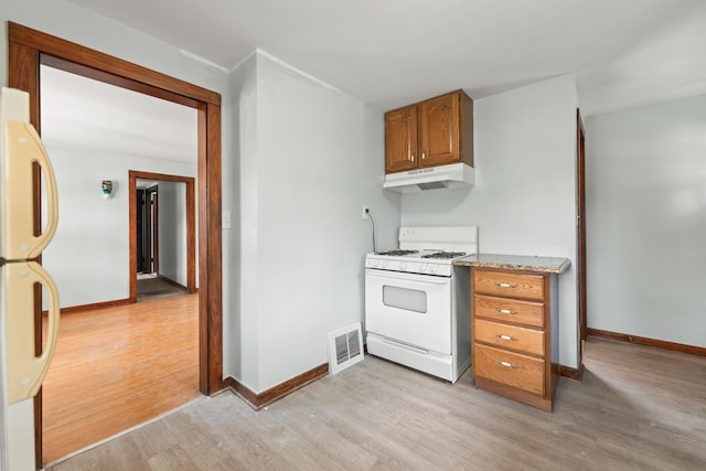 637/639 E Wilson St, Batavia, IL 60510 - kitchen featuring white appliances, under cabinet range hood, light wood-style flooring, and brown cabinets