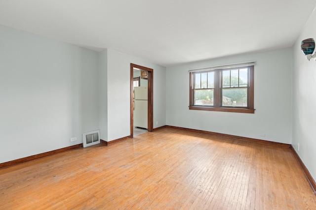 637/639 E Wilson St, Batavia, IL 60510 - empty room with light wood-style floors and baseboards