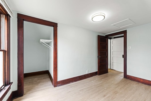 637/639 E Wilson St, Batavia, IL 60510 - unfurnished bedroom featuring light wood finished floors, attic access, and a closet