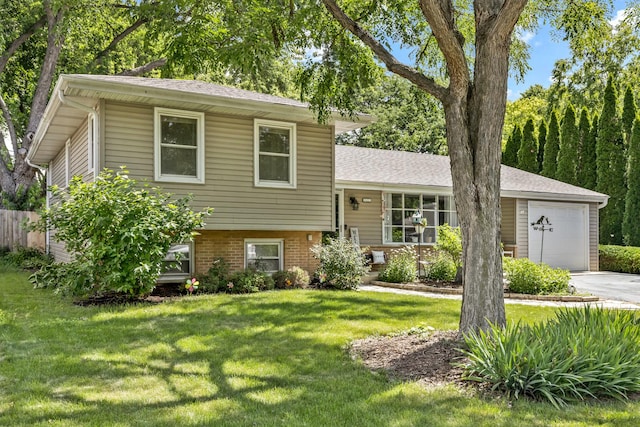 3S221 Sequoia Dr, Glen Ellyn, IL 60137 - split level home with an attached garage, a front lawn, brick siding, driveway, and a shingled roof