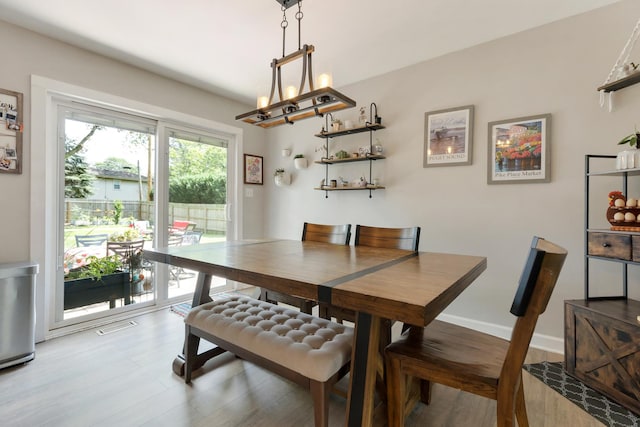 3S221 Sequoia Dr, Glen Ellyn, IL 60137 - dining area featuring light wood finished floors and a chandelier
