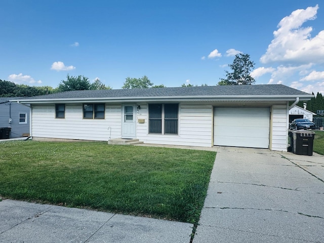 119 N Park Blvd, Freeport, IL 61032 - ranch-style house with driveway, a front lawn, entry steps, an attached garage, and a shingled roof