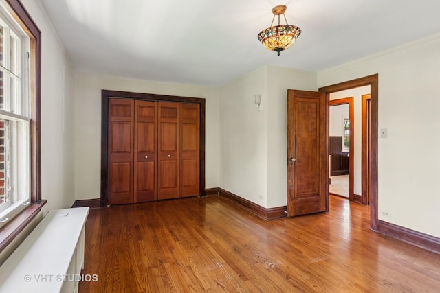 733 N Kensington Ave, La Grange Park, IL 60526 - unfurnished bedroom with wood finished floors and a closet