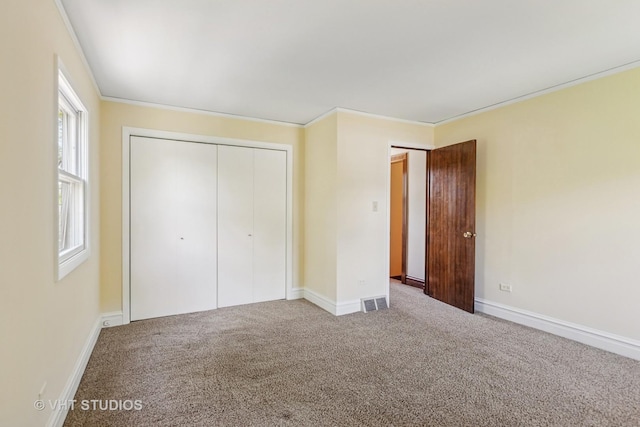 733 N Kensington Ave, La Grange Park, IL 60526 - unfurnished bedroom with a closet, carpet, and ornamental molding